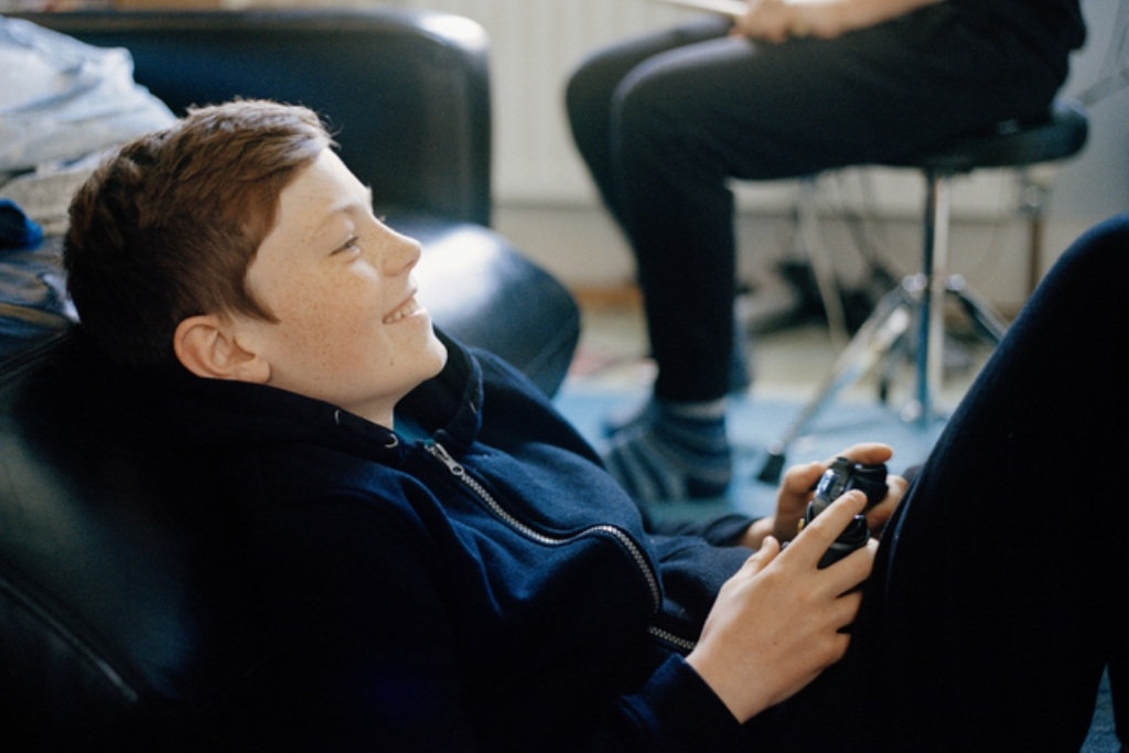 Child teen playing online video games on computer Vector Image