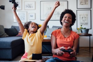 MOm and daughter laying a video game