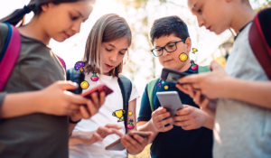 A group of kids playing mobile games together