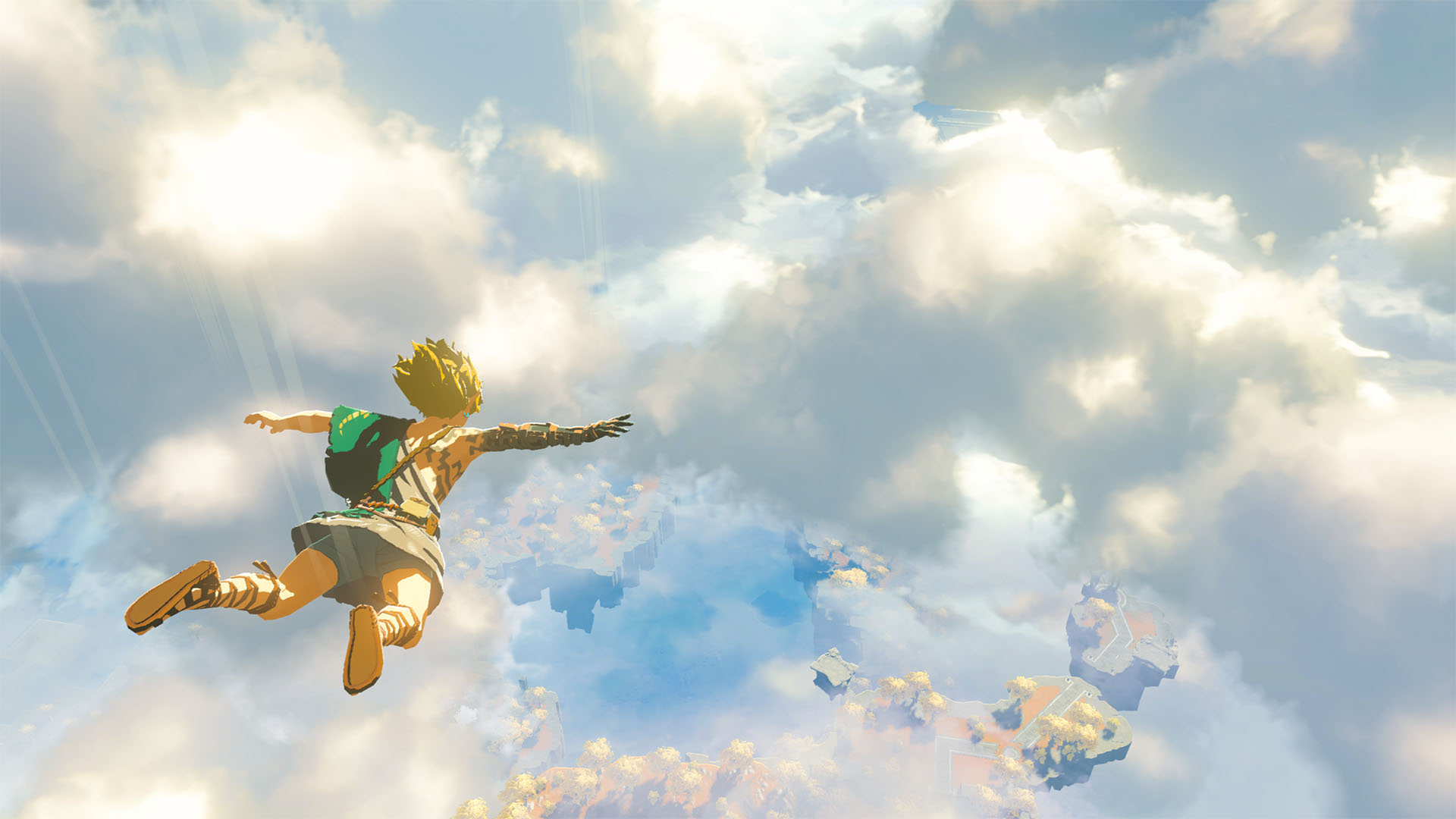 Link from the Legend of Zelda falls majestically from far above the Kingdom of Hyrule. His arms and legs are outstretched like a skydiver and his blond hair whips in the wind as he falls. Beneath him is a vast landscape partially obsuded by white clouds. The sky is also dotted with floating islands.
