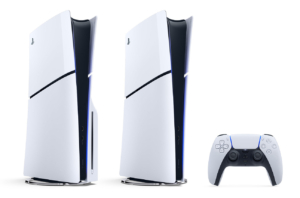 An image of the PlayStation 5 2023 models. On the left is the standard model, including a disk drive. Meanwhile, on the right is a nearly identical looking console, but without a disk drive. They are both white curved rectangles with a black stripe down the middle. To the right of both consoles is a controller.