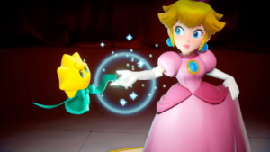 Peach is joined by stella, a ribbon shaped creature with a gold head and green threads for a body and arms.