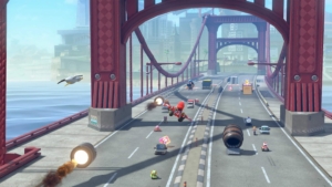 Mario and other other racers drive and glide on a long, red bridge. Bullet Bills and other civilian drivers dot the four-lane bridge, threatening to either impede or boost the racers. 