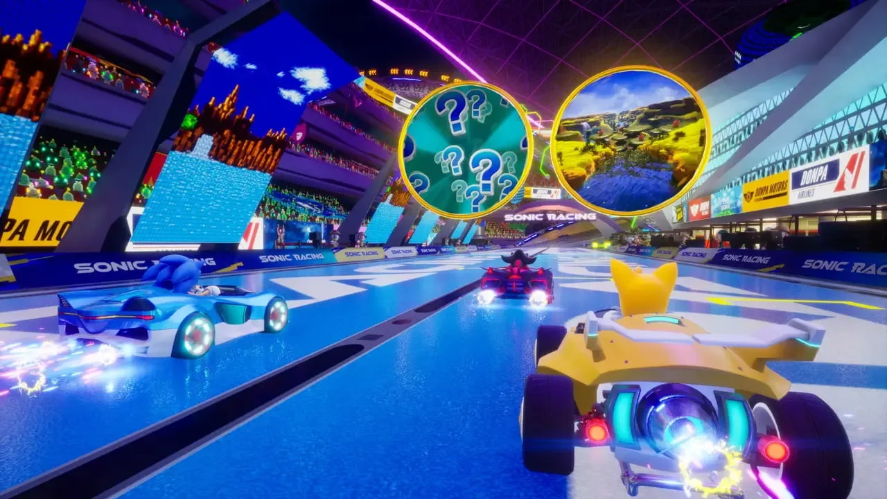Sonic, Tails, and Knuckles are racing! Ahead of them, there are two giant rings, each representing a new track. 