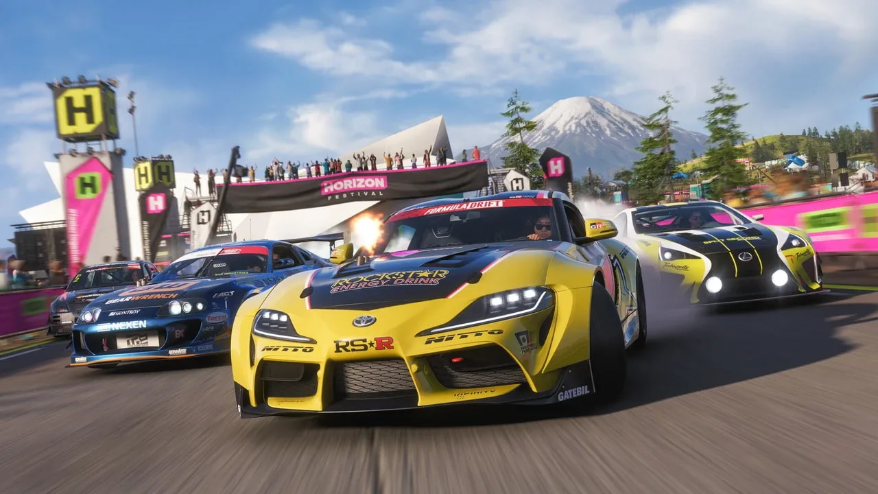 Four cars are seen bursting through the start of a race in the Horizon Festival.