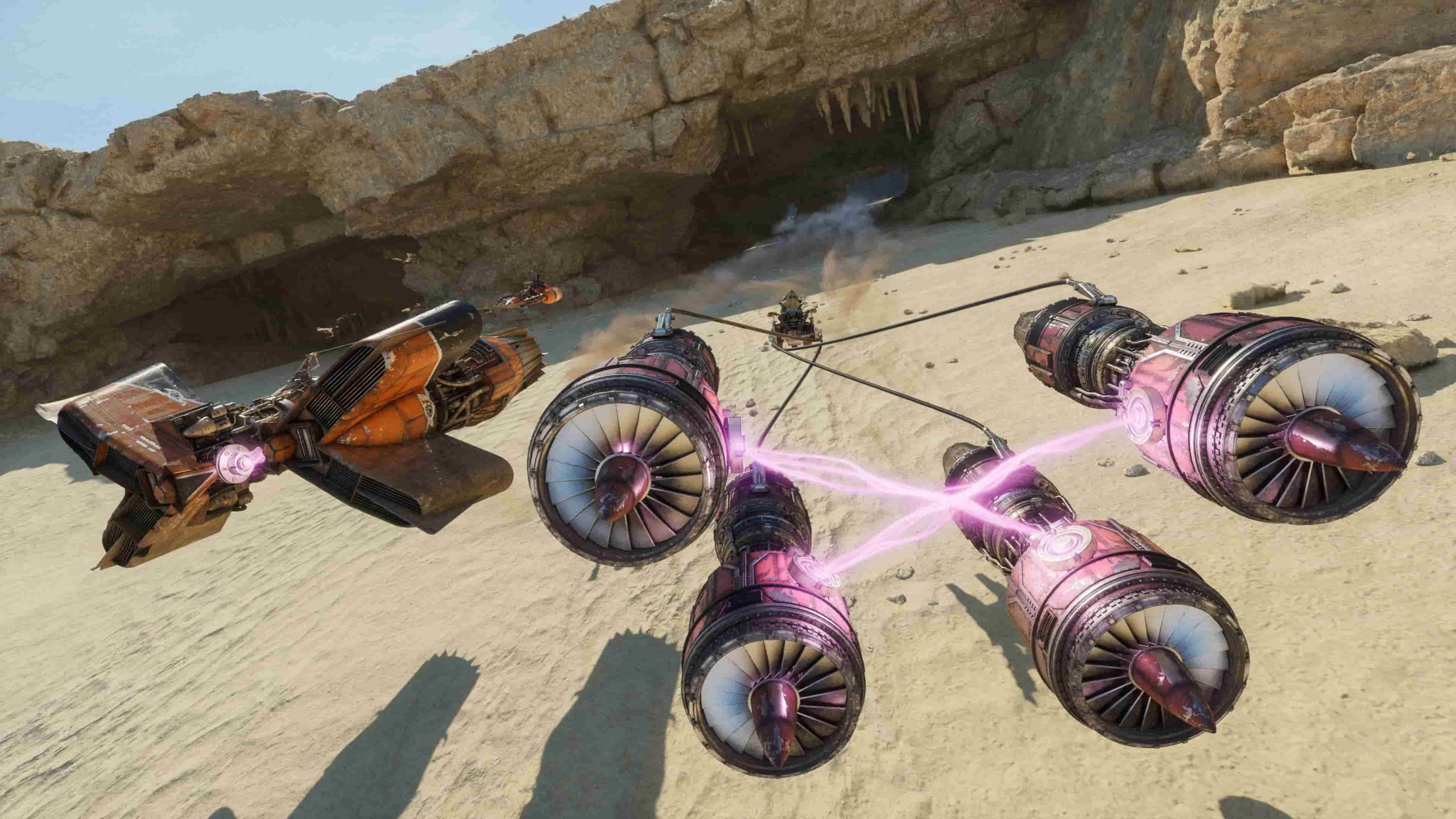 A Podrace in Star Wars: Galactic Racer. There are two racers on screen, one with an orange podracer, and the other with a purple podracer with four turbines connected by lasers. They are racing on a desert planet.