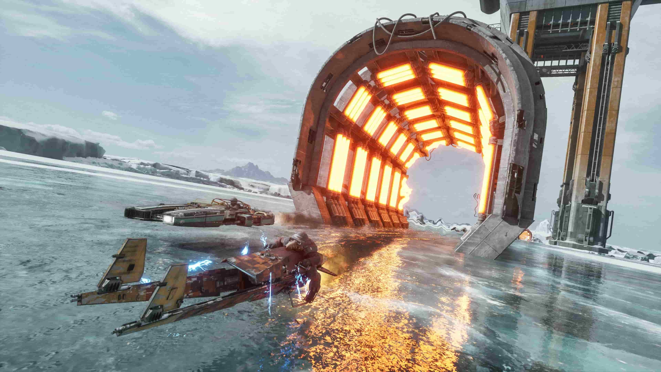 A race on an icy planet in Star Wars: Galactic Racer. The two racers are exiting a heated tunnel, helping them stave off the freezing temperatures and damage to their vehicles.